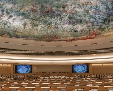 Geneva Switzerland - August 23 2014 : Human Rights and Alliance of Civilizations Room in UN Geneva used by the United Nations Human Rights Council with ceiling sculpture by the prominent contemporary Spanish artist Miquel Barcelo