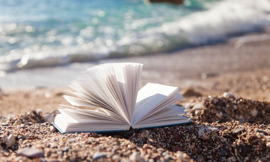 Open book on sea beach