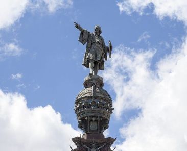 Details of Columbus Monument Barcelona Spain. Bronze statue sculpted by Rafael Atche situated on top of a 40-meter Corinthian column.