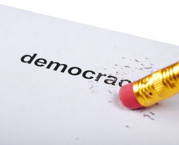 The pencil with eraser kills inscription "democracy"