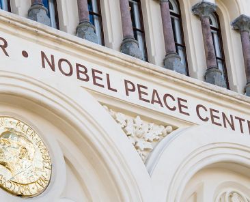 OSLO - APRIL 29: A golden image of the Nobel Peace Prize decorates the front of the Nobel Peace Center in Oslo, Norway, April 29, 2015.