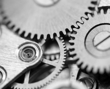 Black white Metallic Background with metal cogwheels a clockwork. Macro