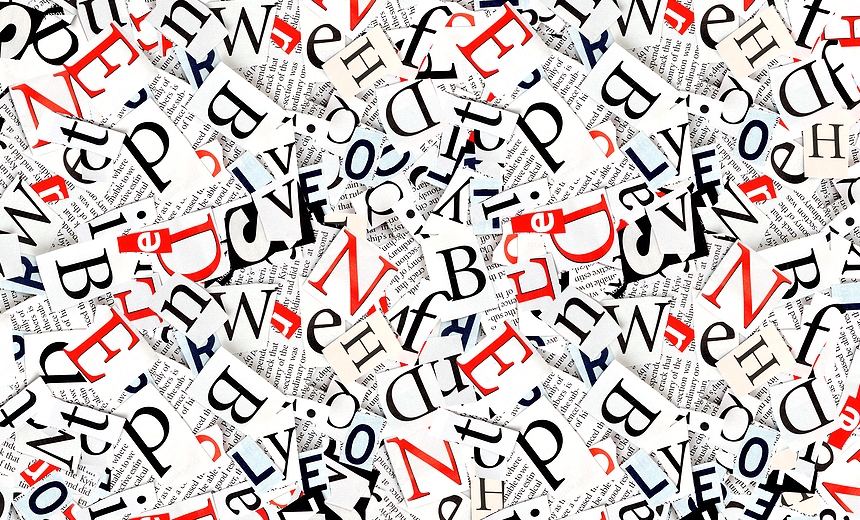 words and letters cut from a magazine, background
