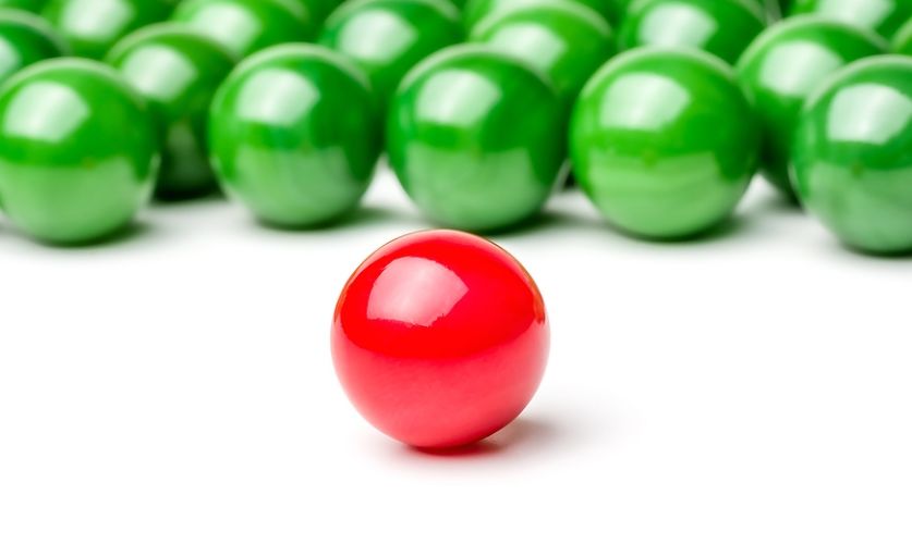 Concept with red and green marbles - Leader