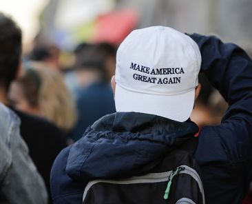 Bucharest, Romania - October 10, 2020: Man wears Make America Great Again cap during a political rally.