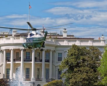 Closer view at the helicopter flying in front of the White House in Washington D.C. USA. It was established in 1800. Serves as an official residence and workplace for the US President.