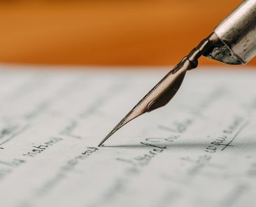 Fountain pen on an ancient handwritten letter. Old story. Retro style.